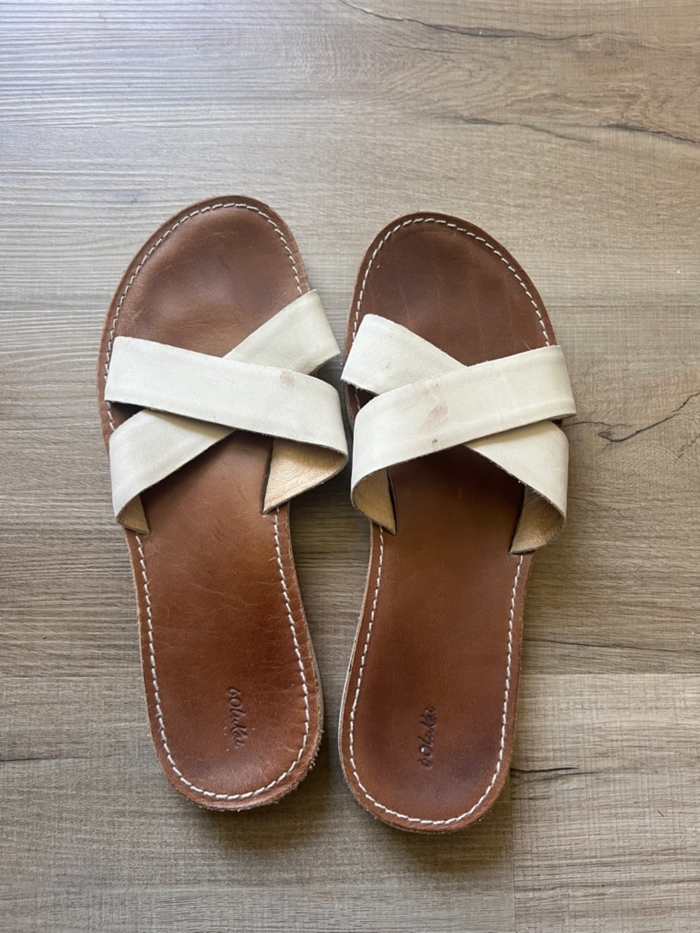 OluKai Cream Crisscross Slide Sandals with Brown Footbed